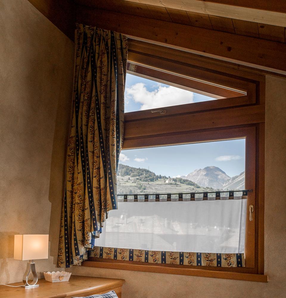 de_luxe_family_estilo_alpino_ático_vista_montaña-3